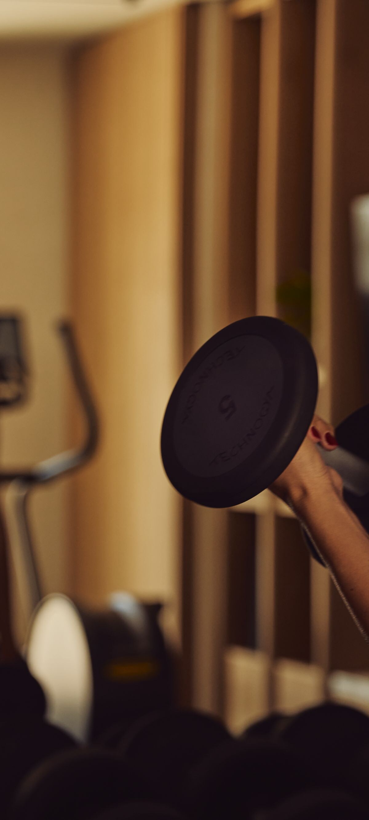 Guest lifting weights in the hotel gym