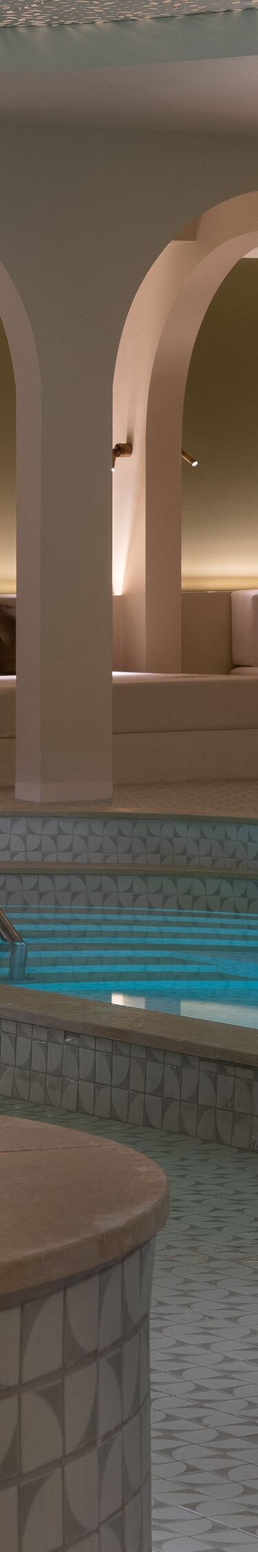 Indoor swimming pool overview at hotel spa
