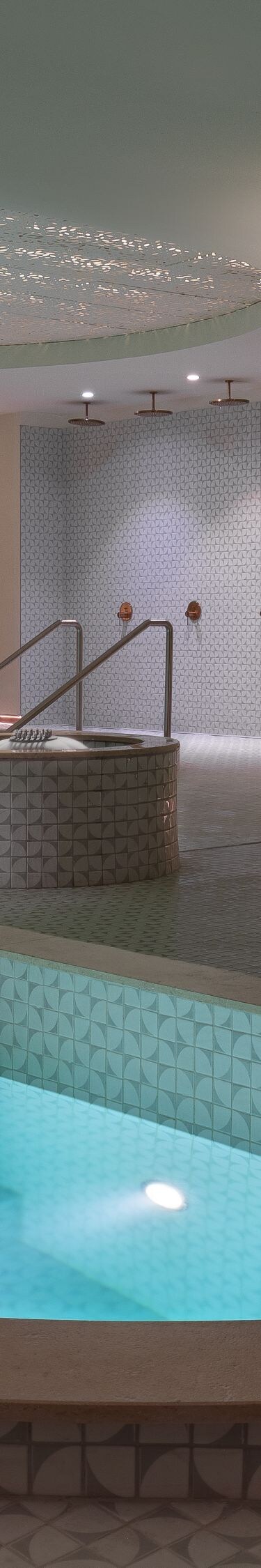 Jacuzzi and indoor pool view at hotel spa