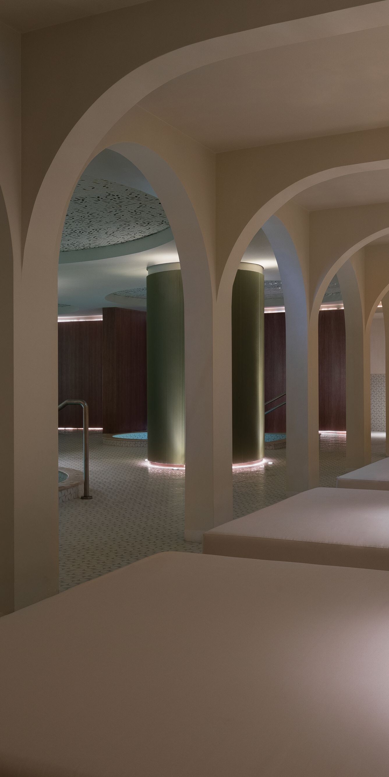 Modern indoor pool corner and lounge chairs