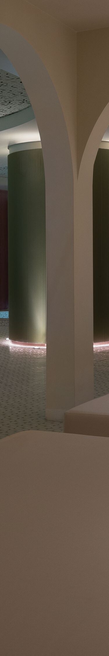 Modern indoor pool corner and lounge chairs