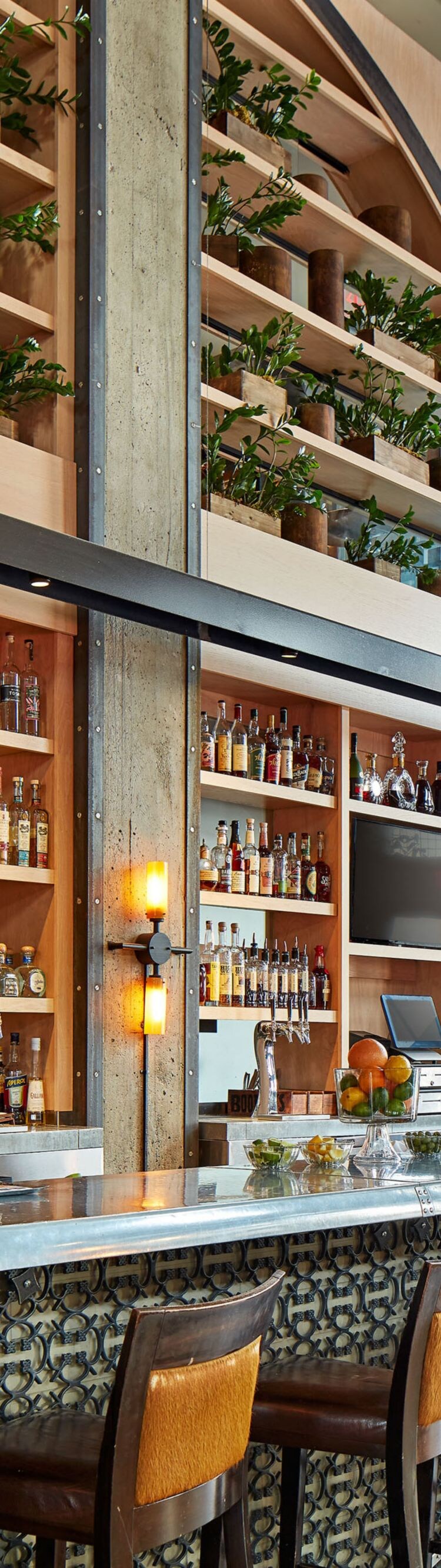 Hotel Bar with Alcohol Display and High Top Seat