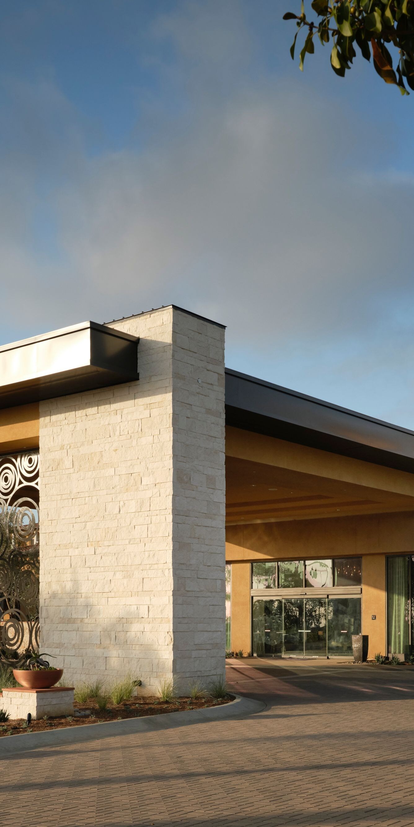 Hotel entrance with drive and modern facade