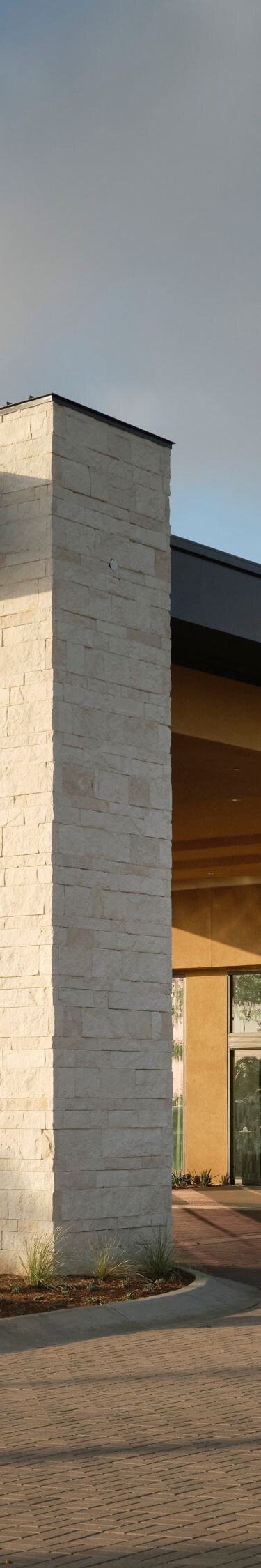 Hotel entrance with drive and modern facade