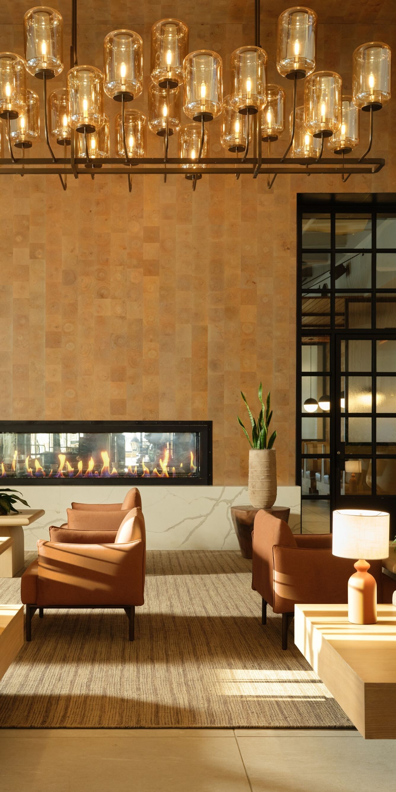 Lobby lounge with fireplace and hanging lights