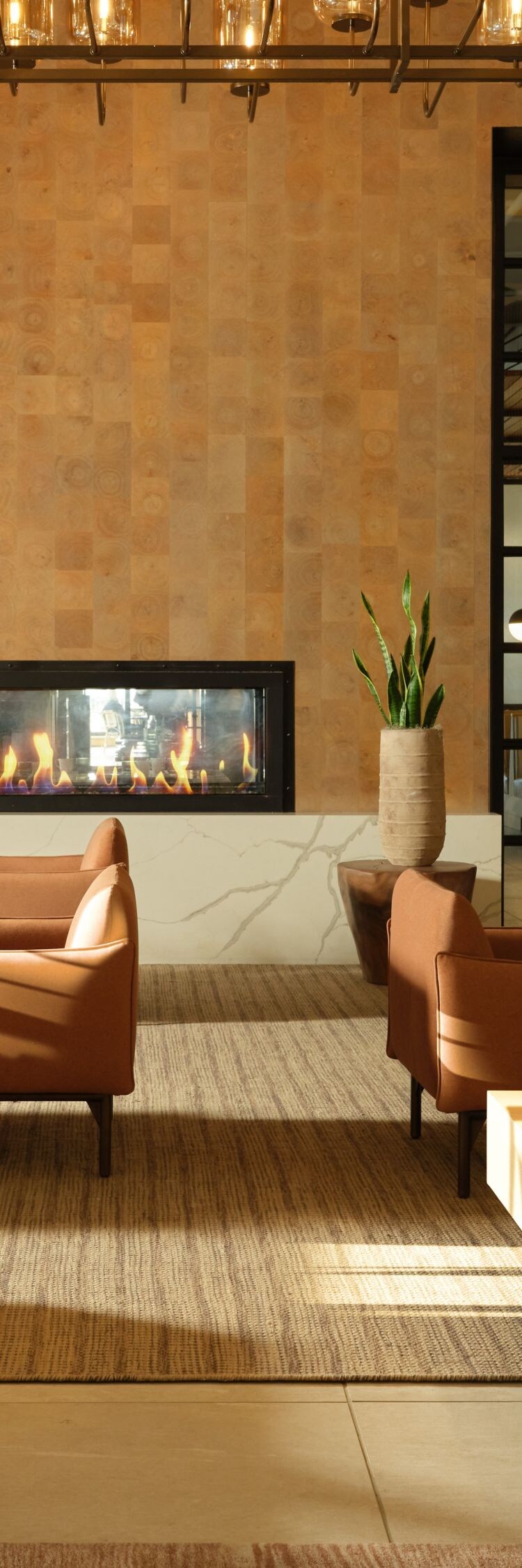 Lobby lounge with fireplace and hanging lights
