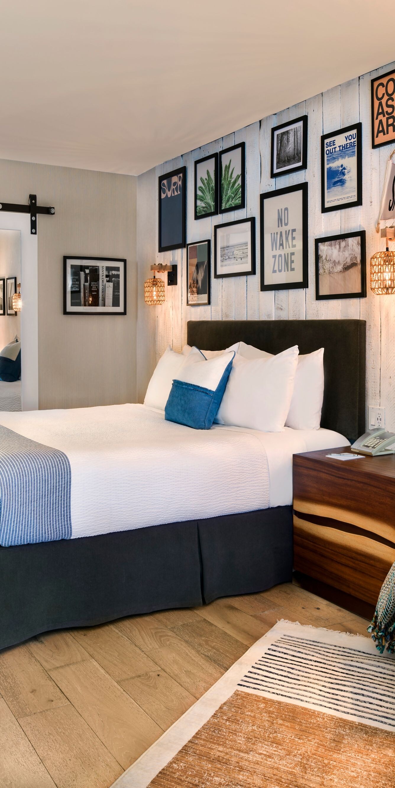 King bed with wall art and open bath area