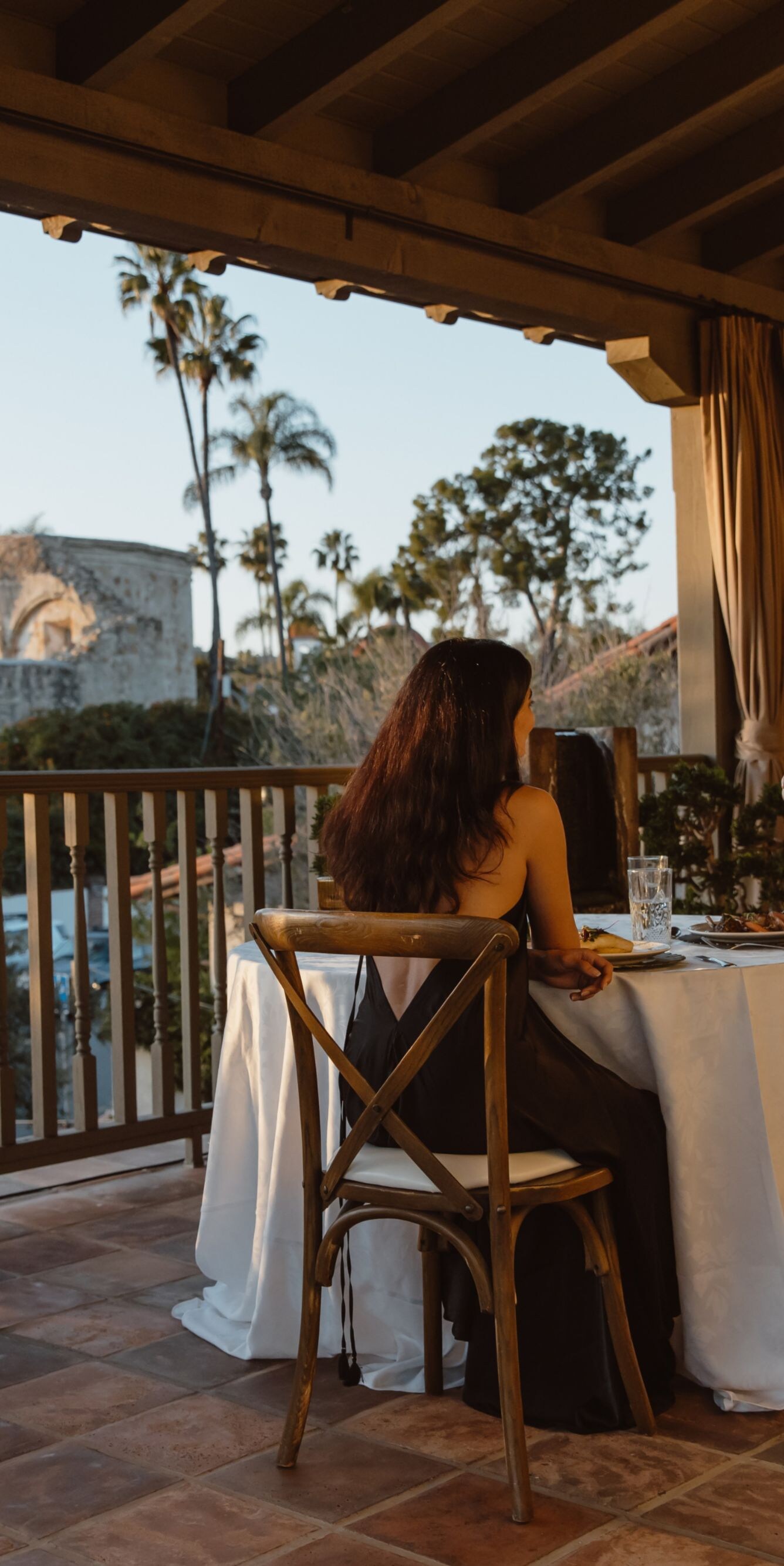 Couple enjoying dinner on an outdoor terrace with 