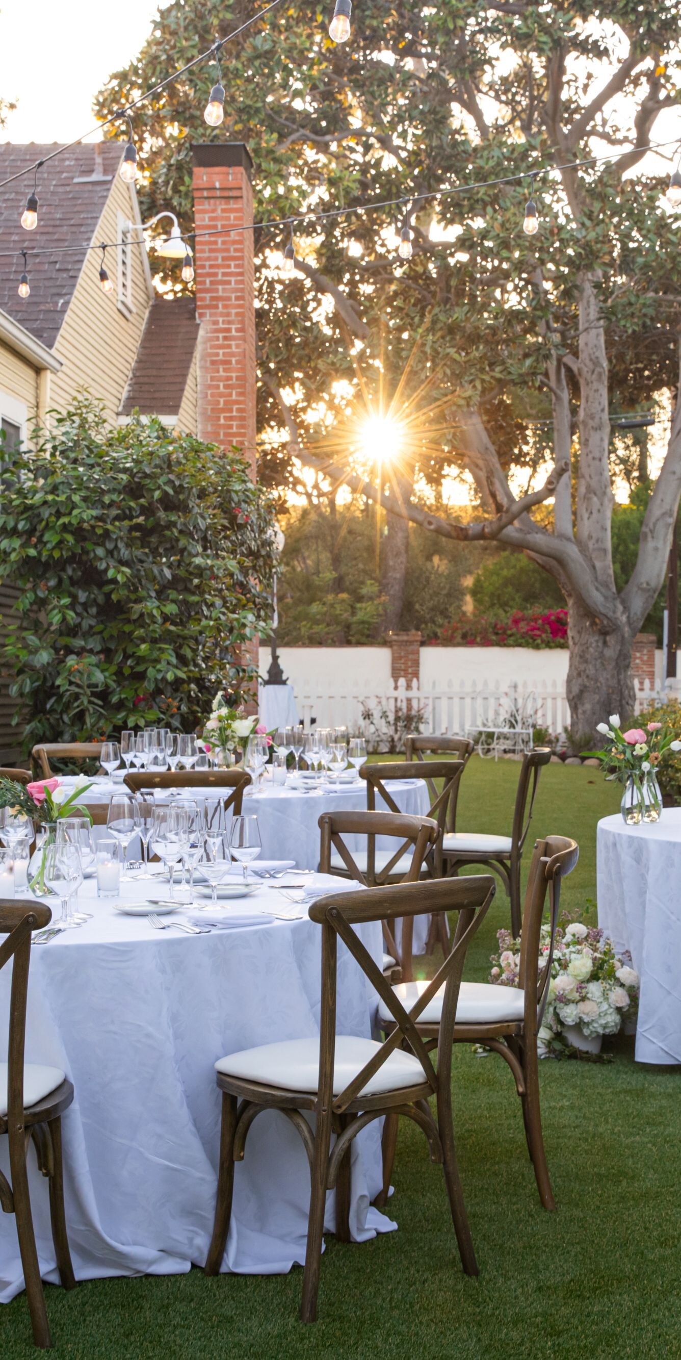 Tables set outdoors for event with decor