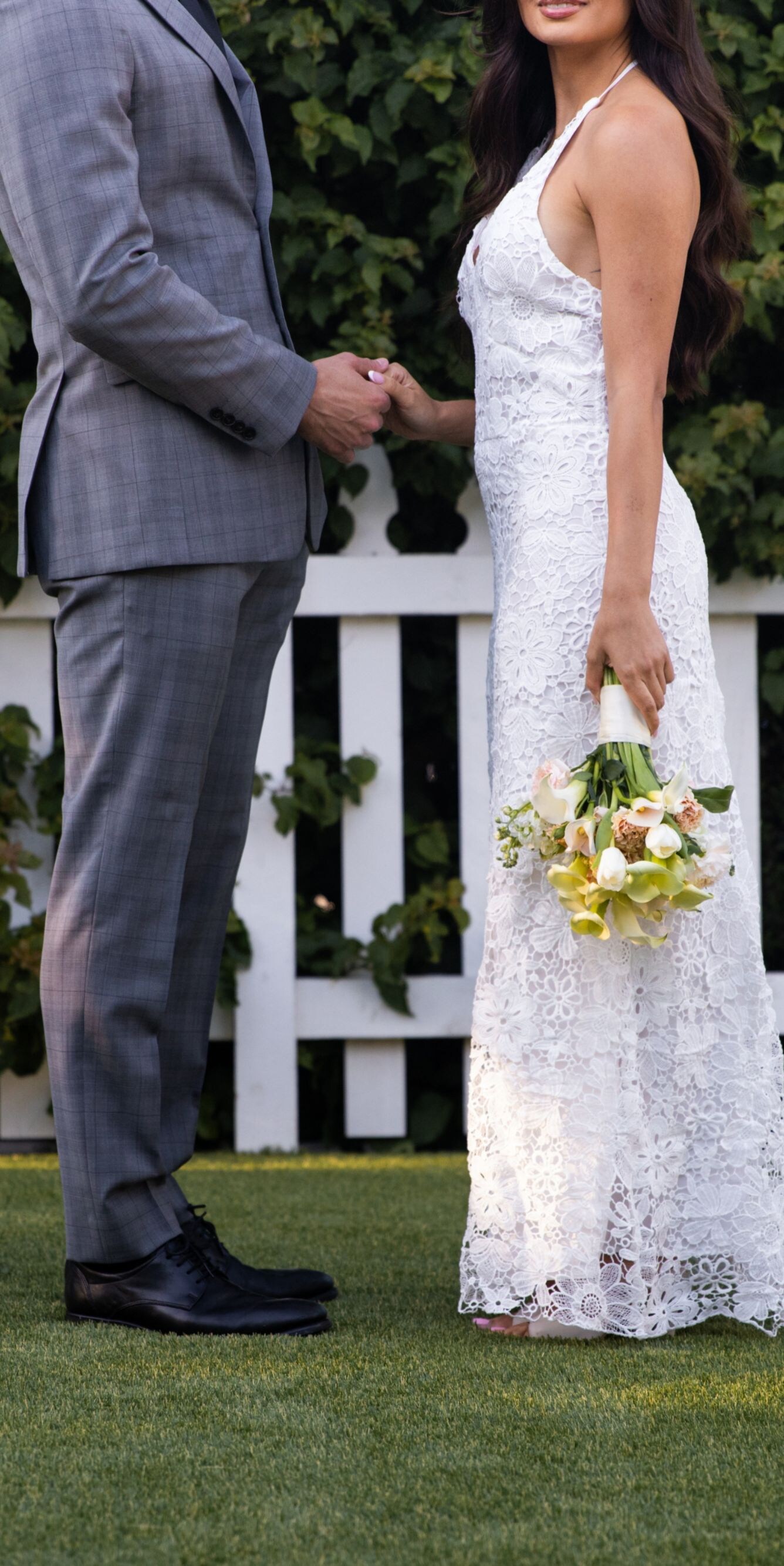Promises spoken softly, surrounded by greenery.