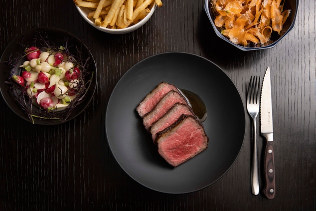 steak on black plate