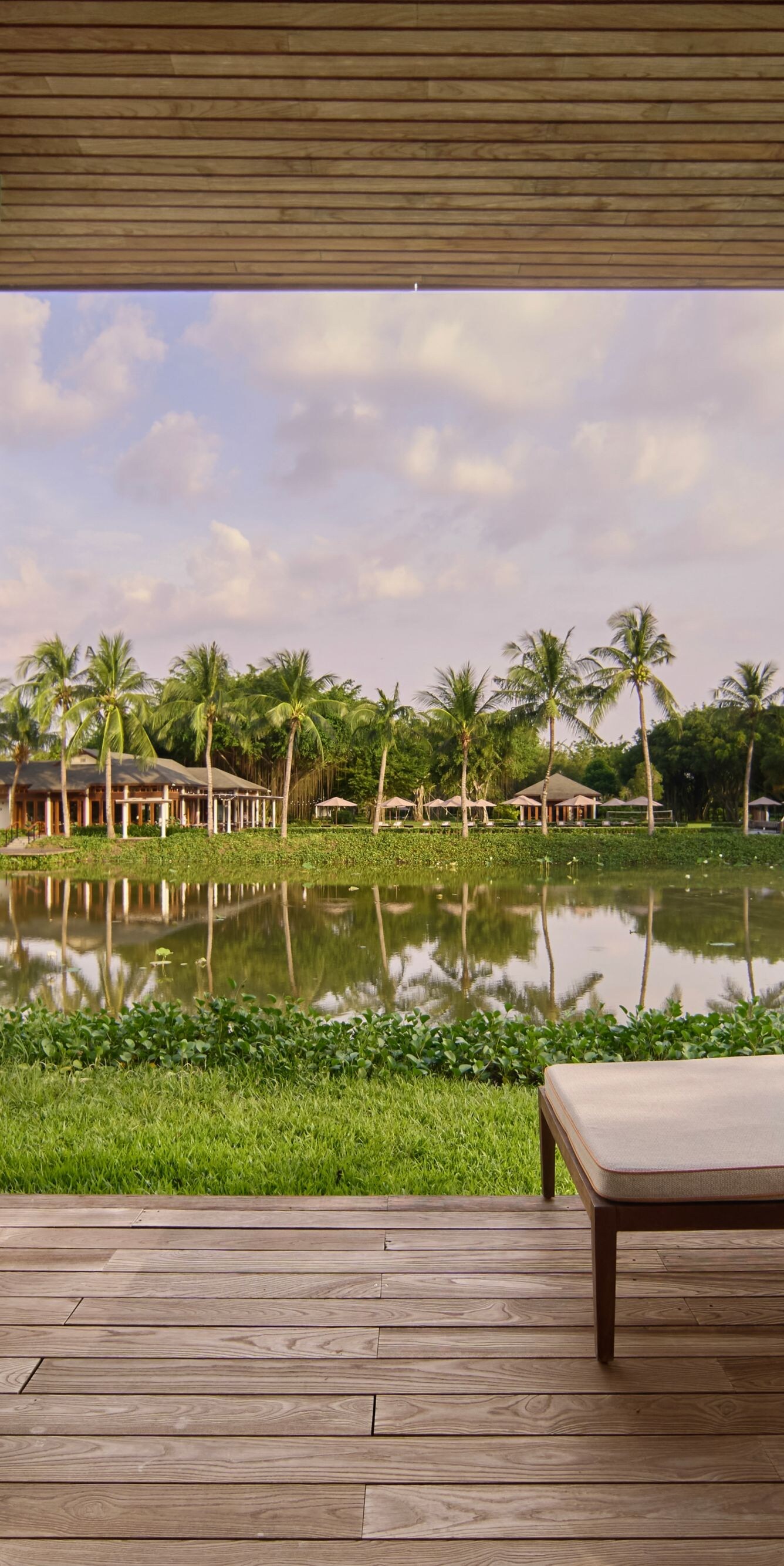 A serene lakeside balcony for peaceful lounging.