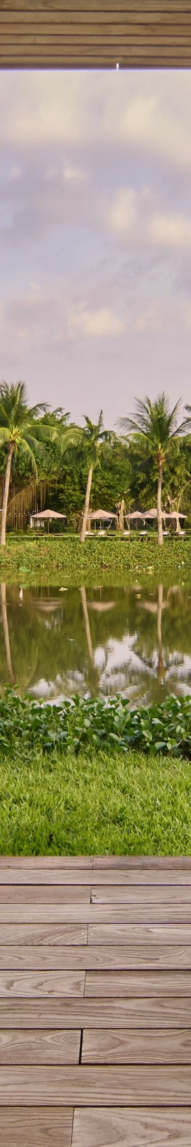 A serene lakeside balcony for peaceful lounging.