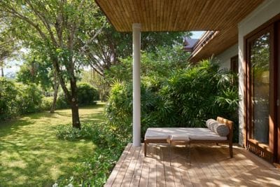 Private balcony surrounded by calming greenery.