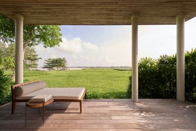 A peaceful balcony with open, breezy water views.