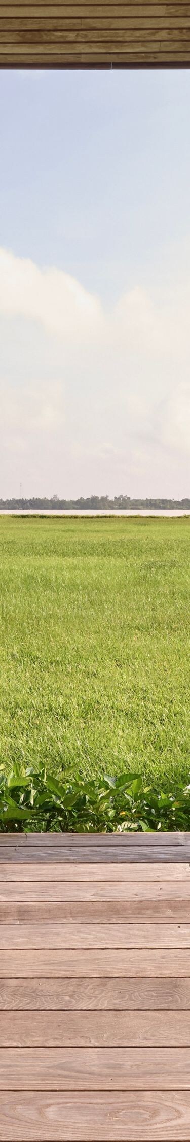 A peaceful balcony with open, breezy water views.