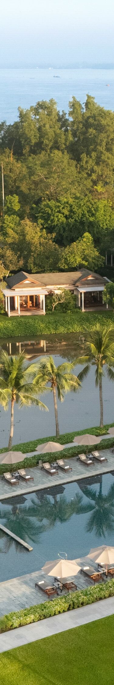 Tranquil pool framed by nature.