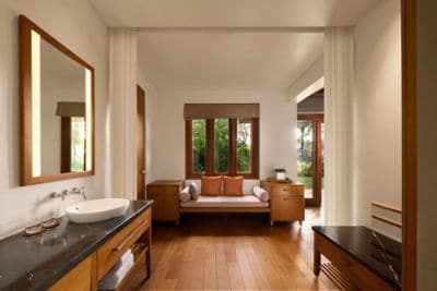Bright, airy bathroom with garden views.