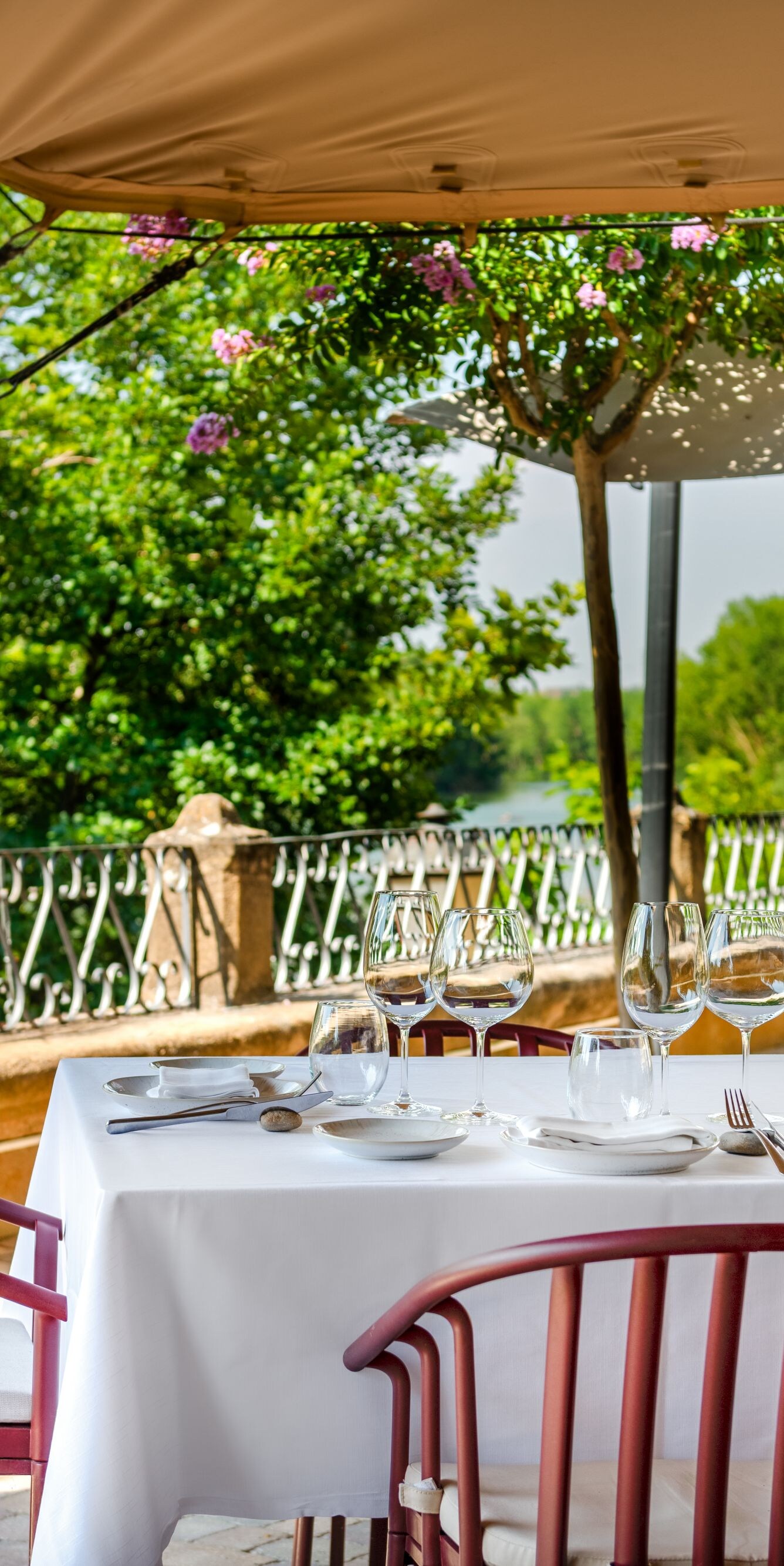 Outdoor dining terrace with river views