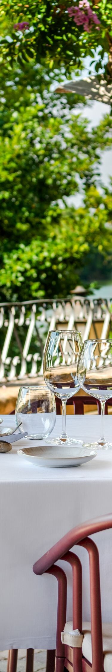 Outdoor dining terrace with river views