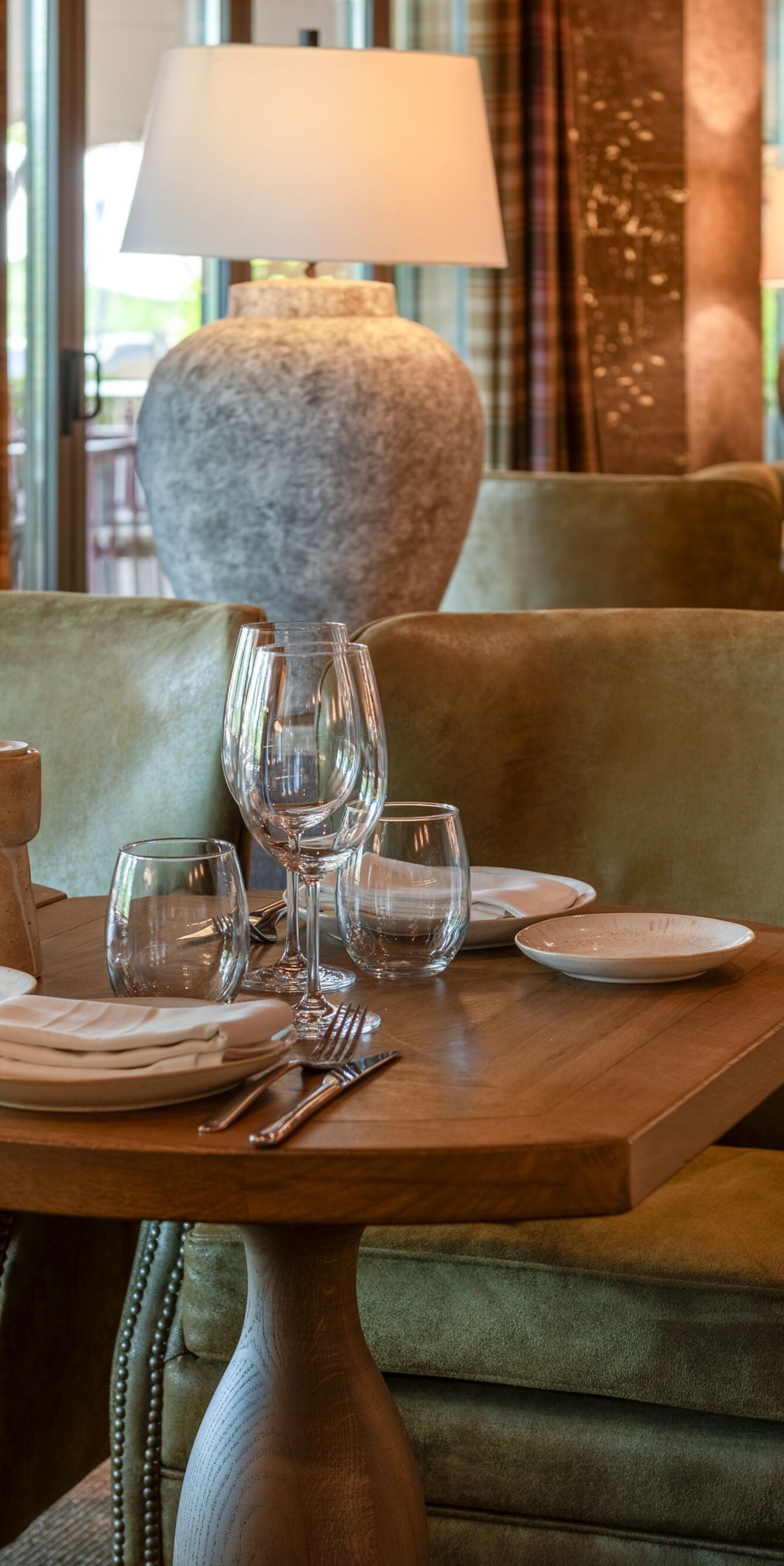 Restaurant seating with green armchairs
