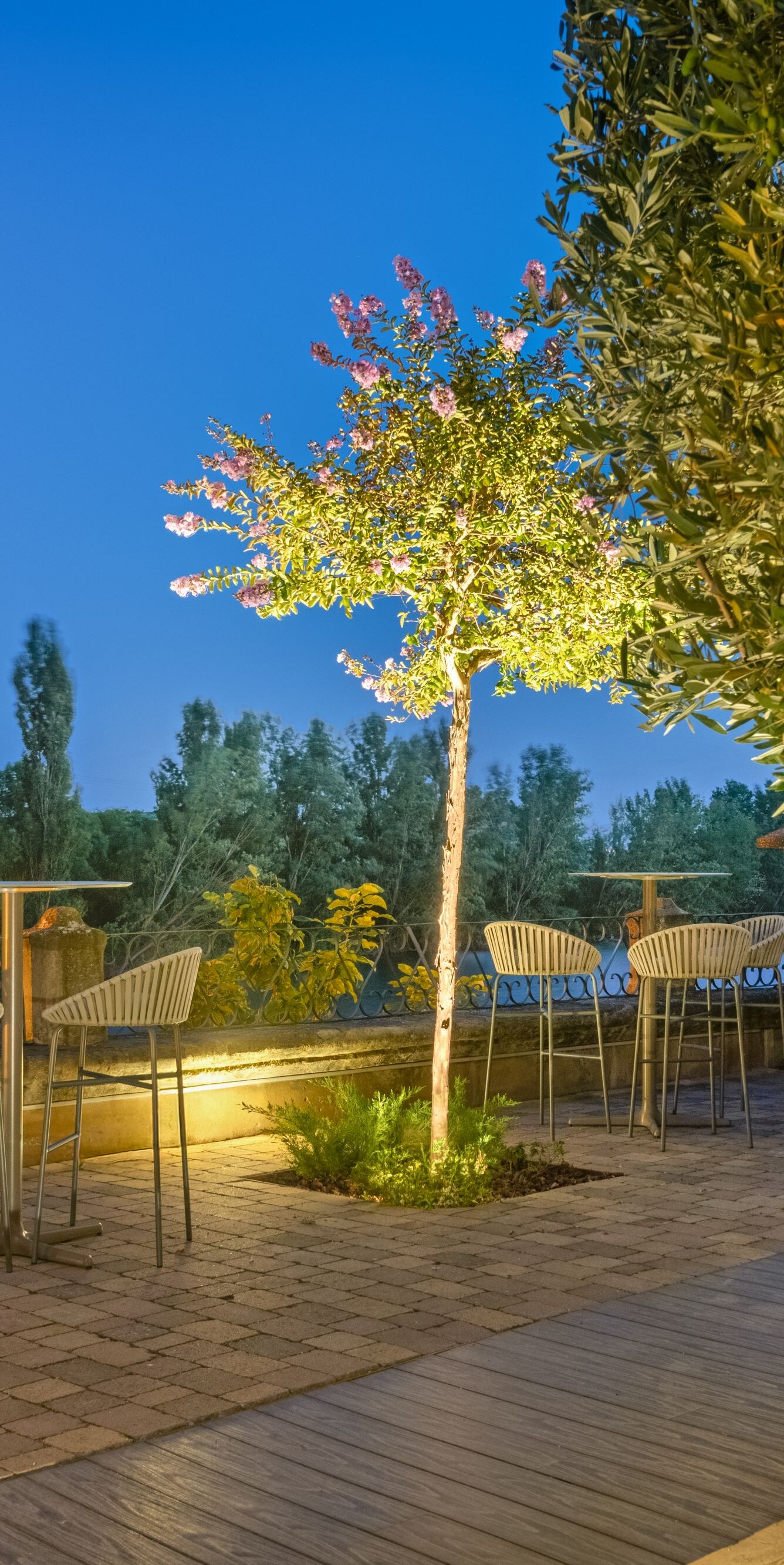 Outdoor terrace with seating and trees