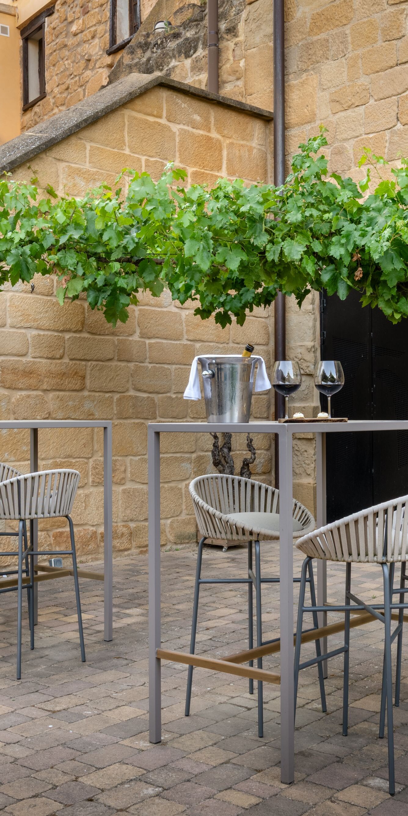 Outdoor patio with wine barrels and seating