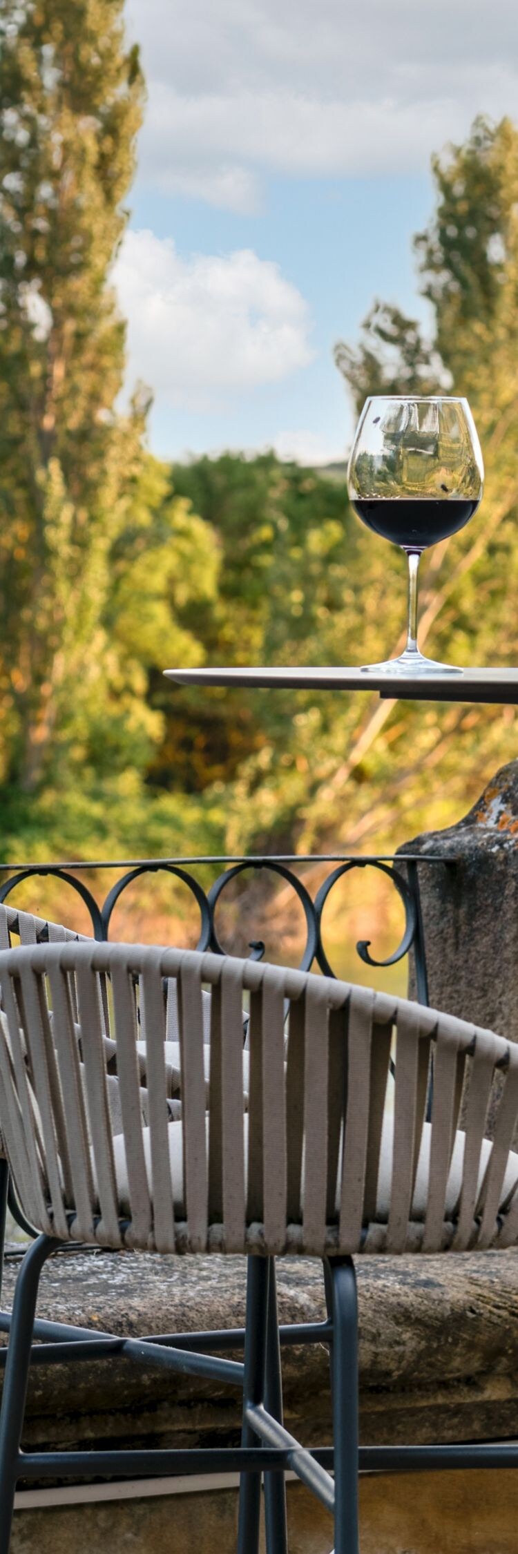 Outdoor terrace with wine and river view