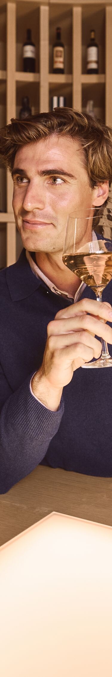 Man in wine room enjoying Wine Tasting