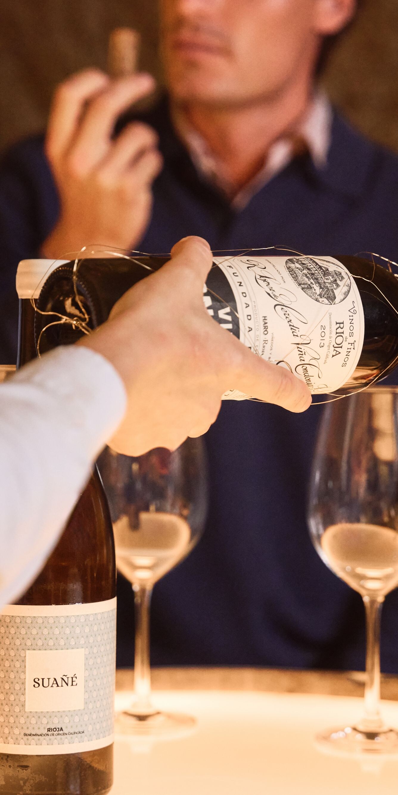 Waiter pouring in glass for Wine Tasting