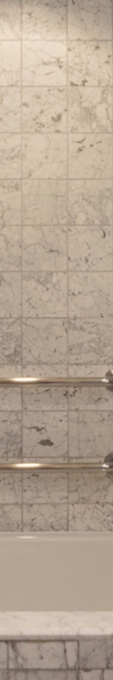 Accessible bathroom with tub, grab bars, vanity