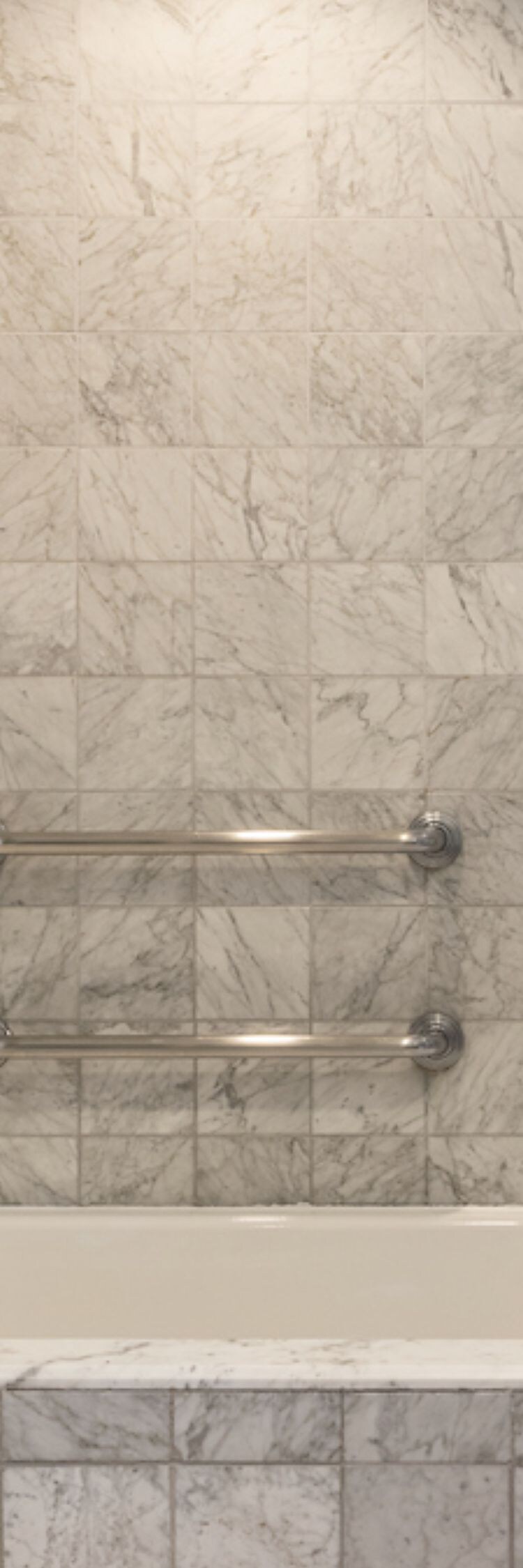 Accessible bath with tub, grab bars, shower wand