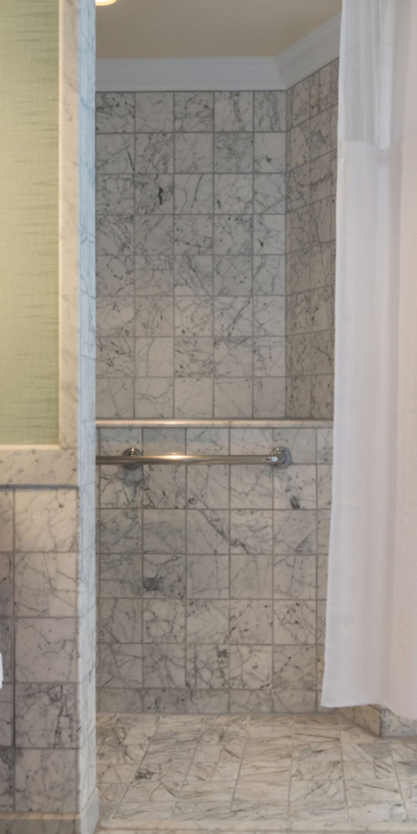 Accessible bath with roll-in shower and grab bar