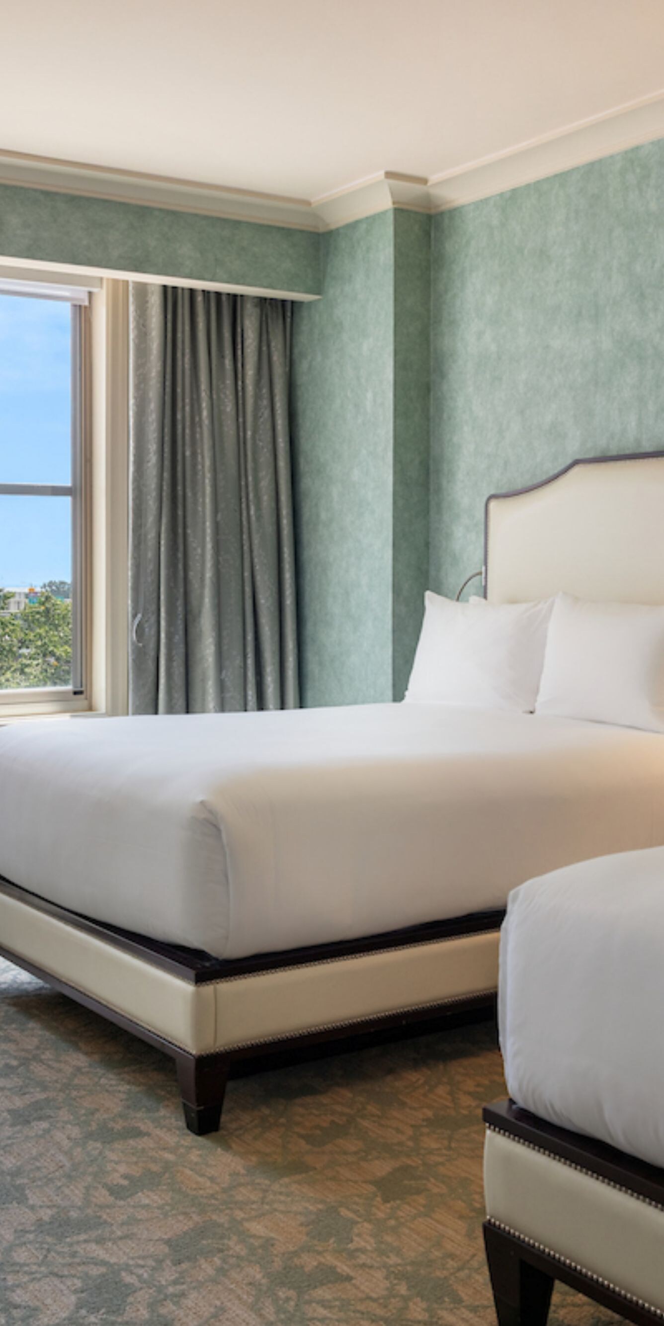 Deluxe room with two queen beds and seating area