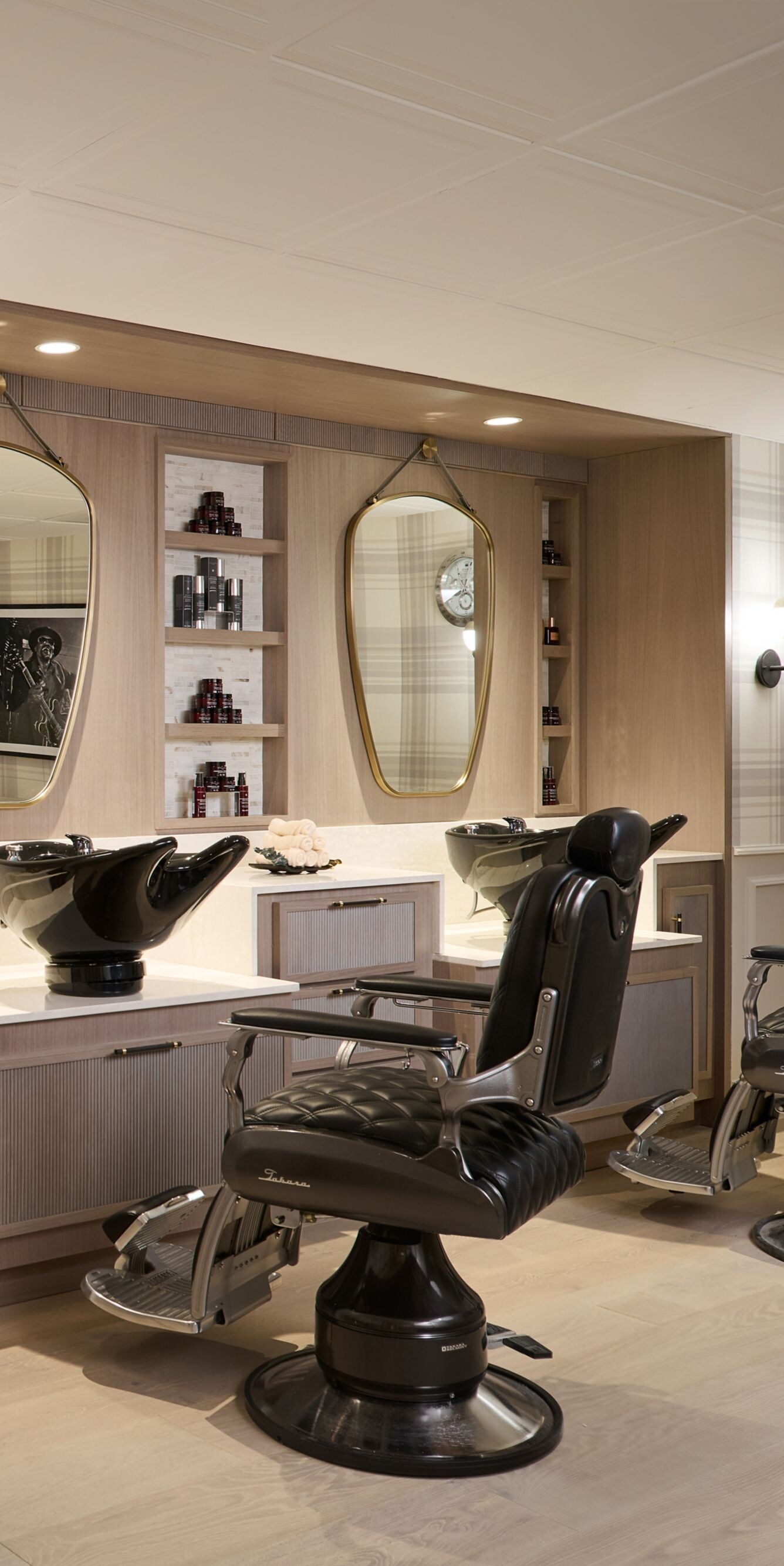 Men's grooming room with barber chairs
