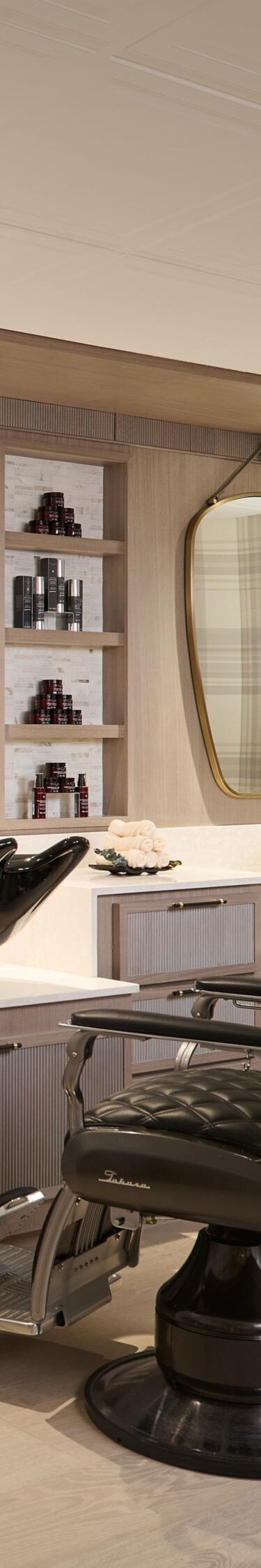 Men's grooming room with barber chairs