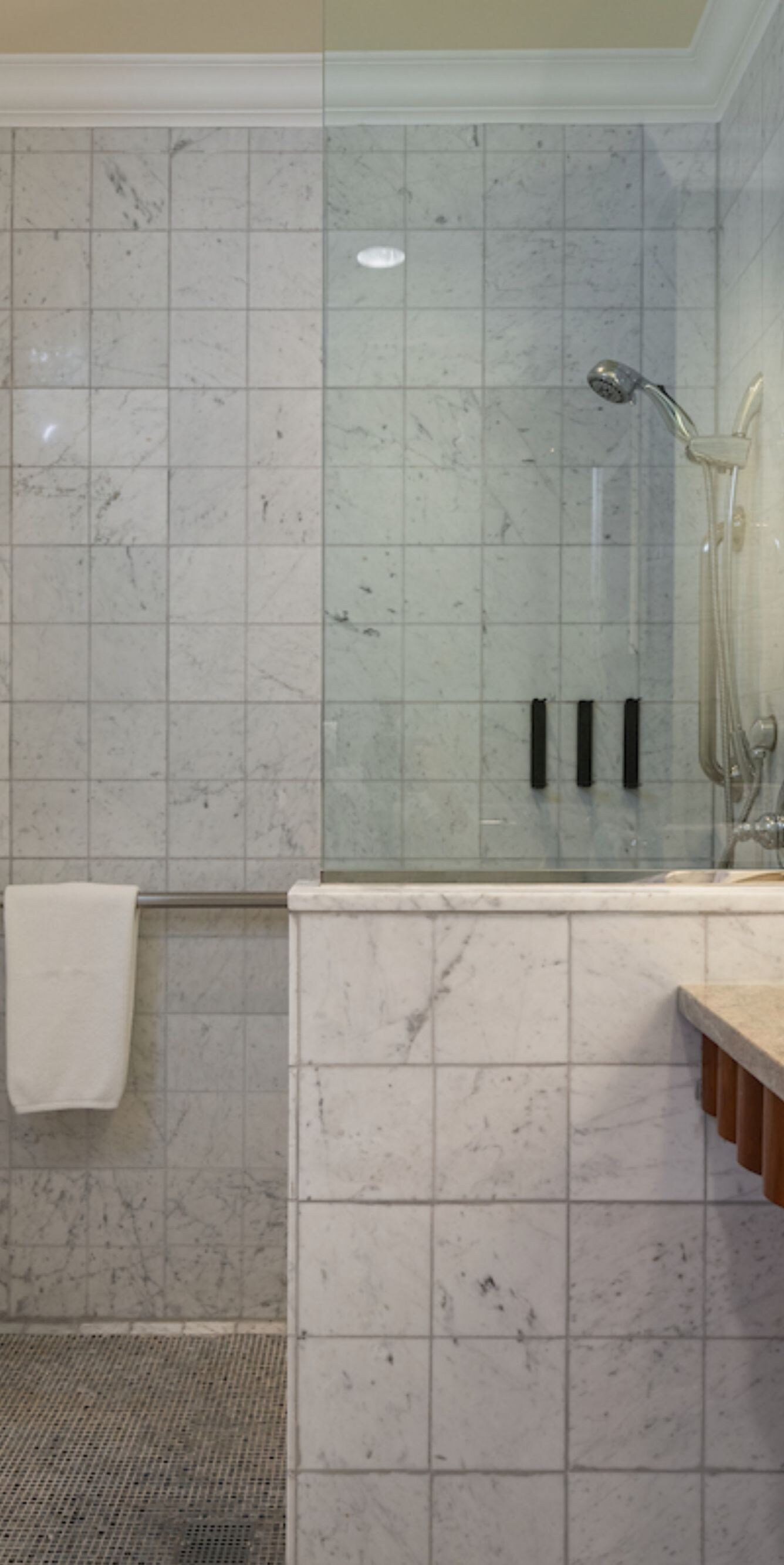 Marble bathroom with walk-in shower & vanity sink