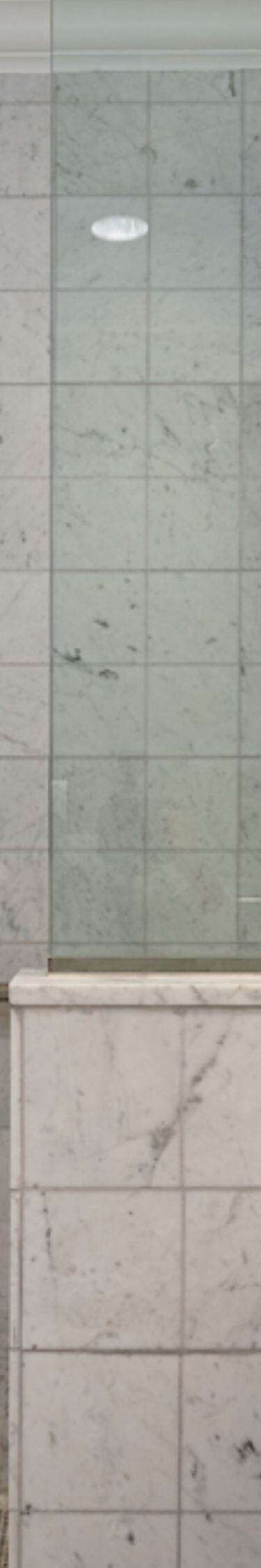 Marble bathroom with walk-in shower & vanity sink