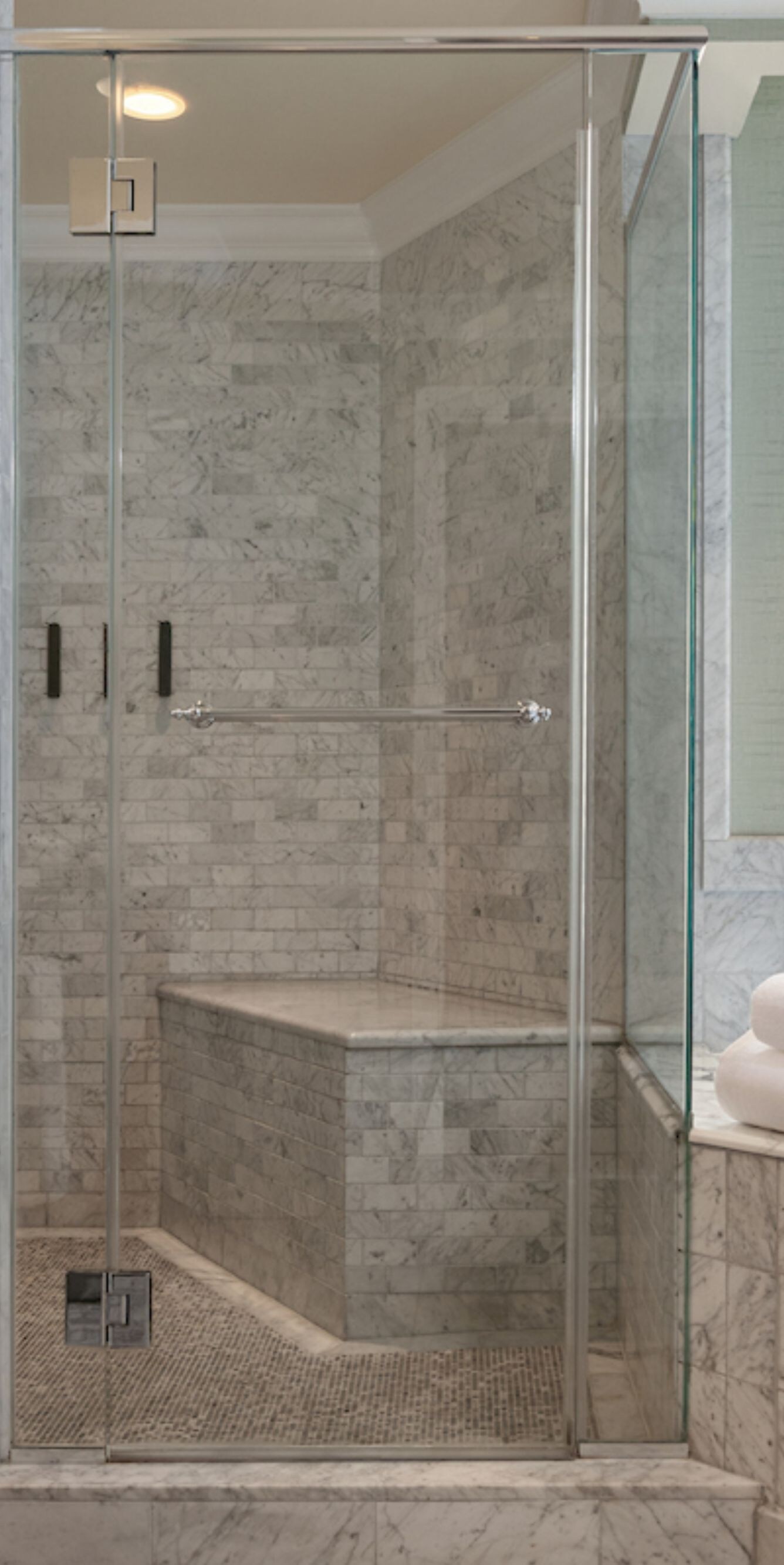 Marble bathroom with shower, tub, and vanity