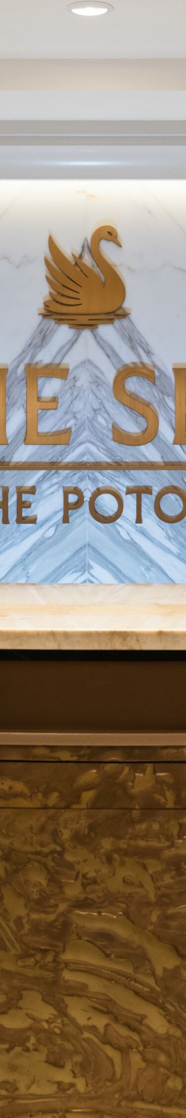 Spa reception desk with marble backdrop