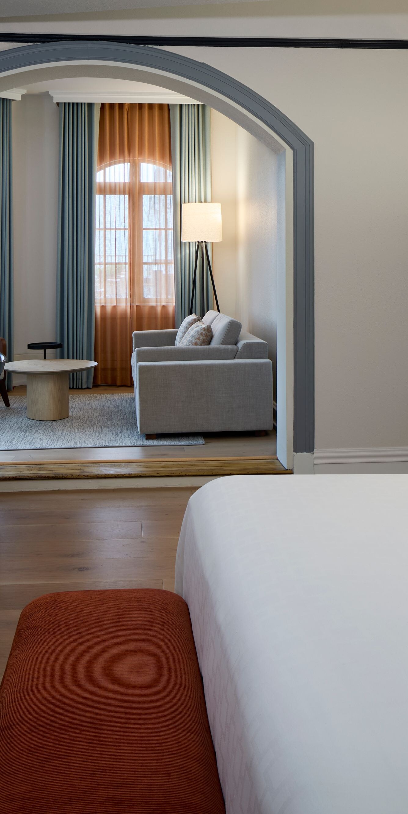 Suite with king bed, dining table, and living room