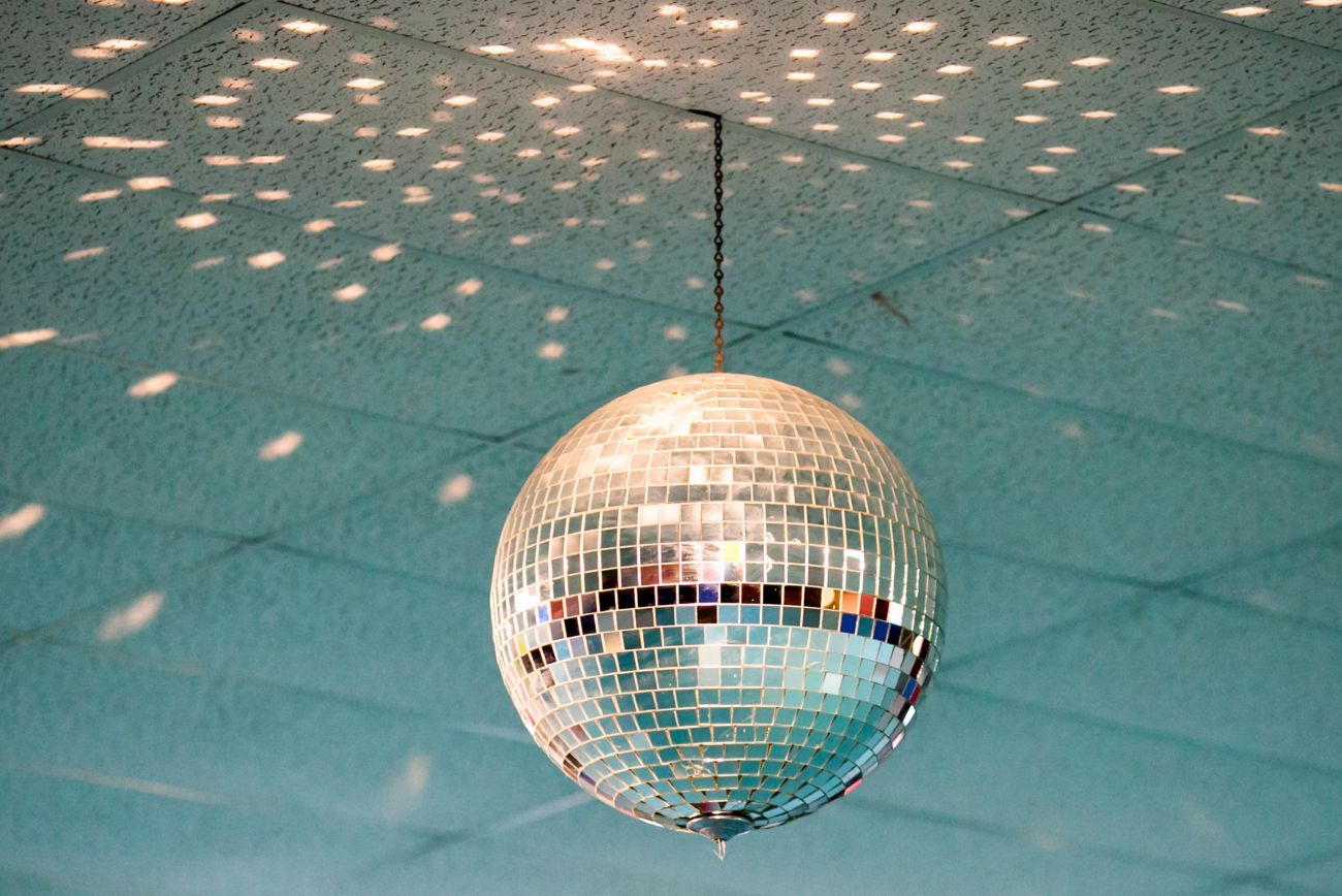 a disco ball on the bar ceiling
