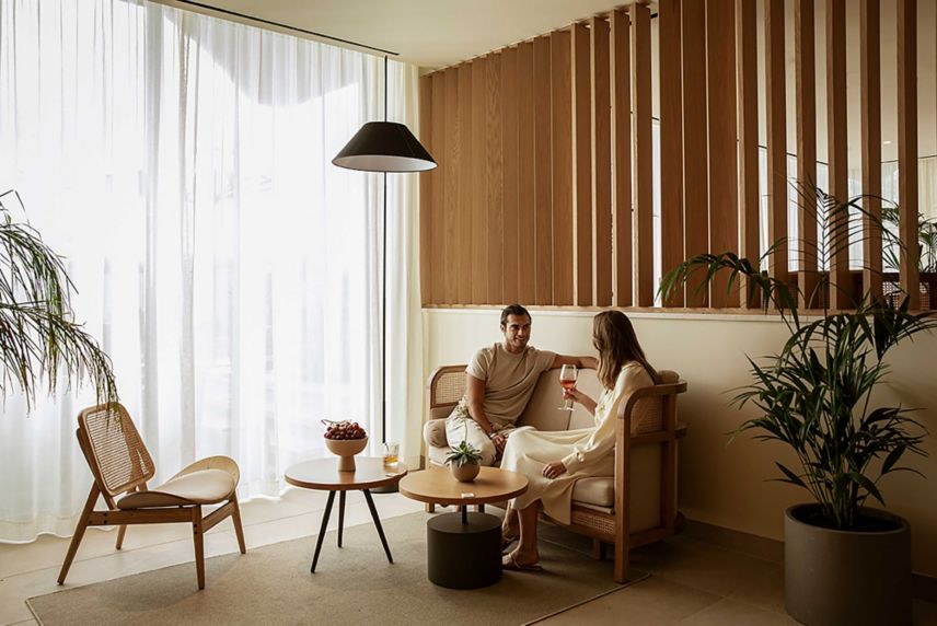 a couple relaxing in the elegantly designed room