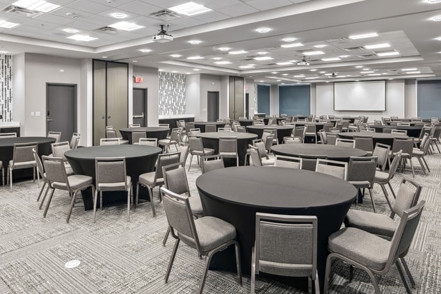 Meeting room with chairs and round tables 