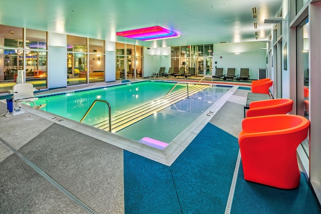 indoor pool and red chairs 
