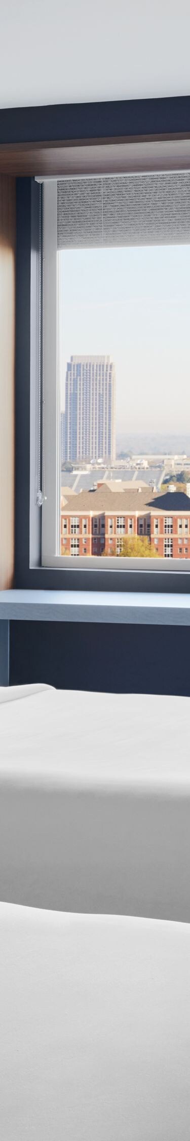 guest room with two queen beds and city view