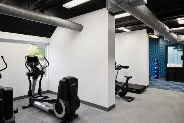 fitness center with elliptical and treadmill