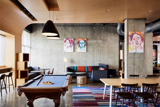 lobby area with seating and pool table