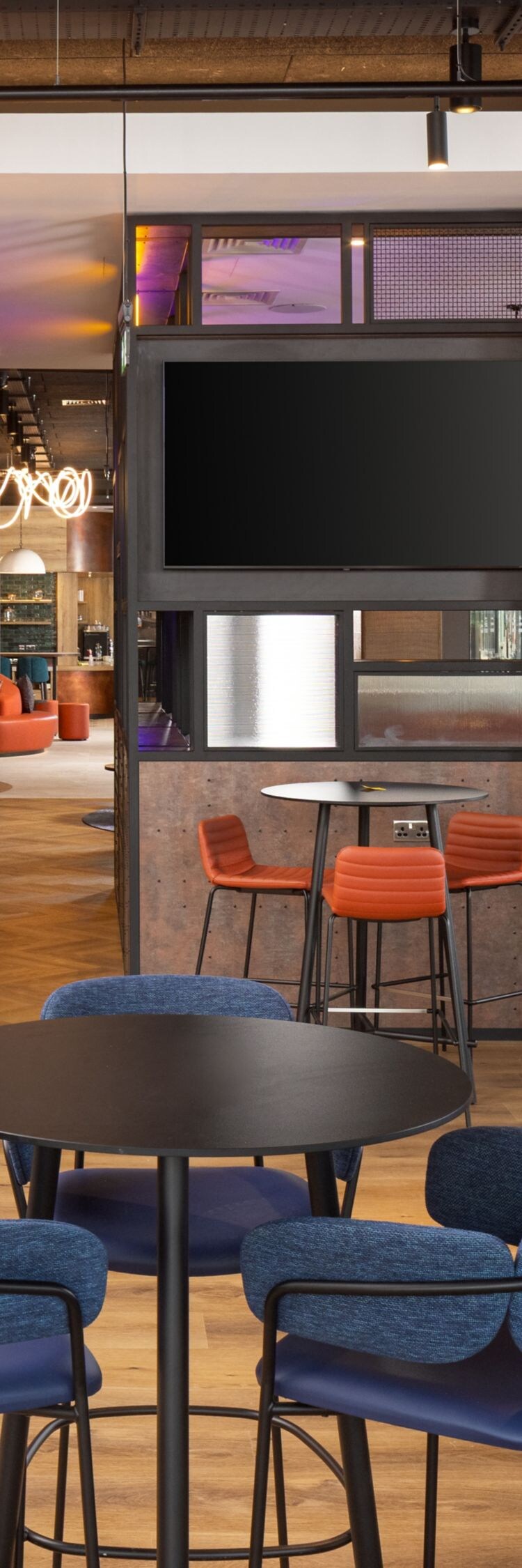 Modern lobby seating with tables and chairs