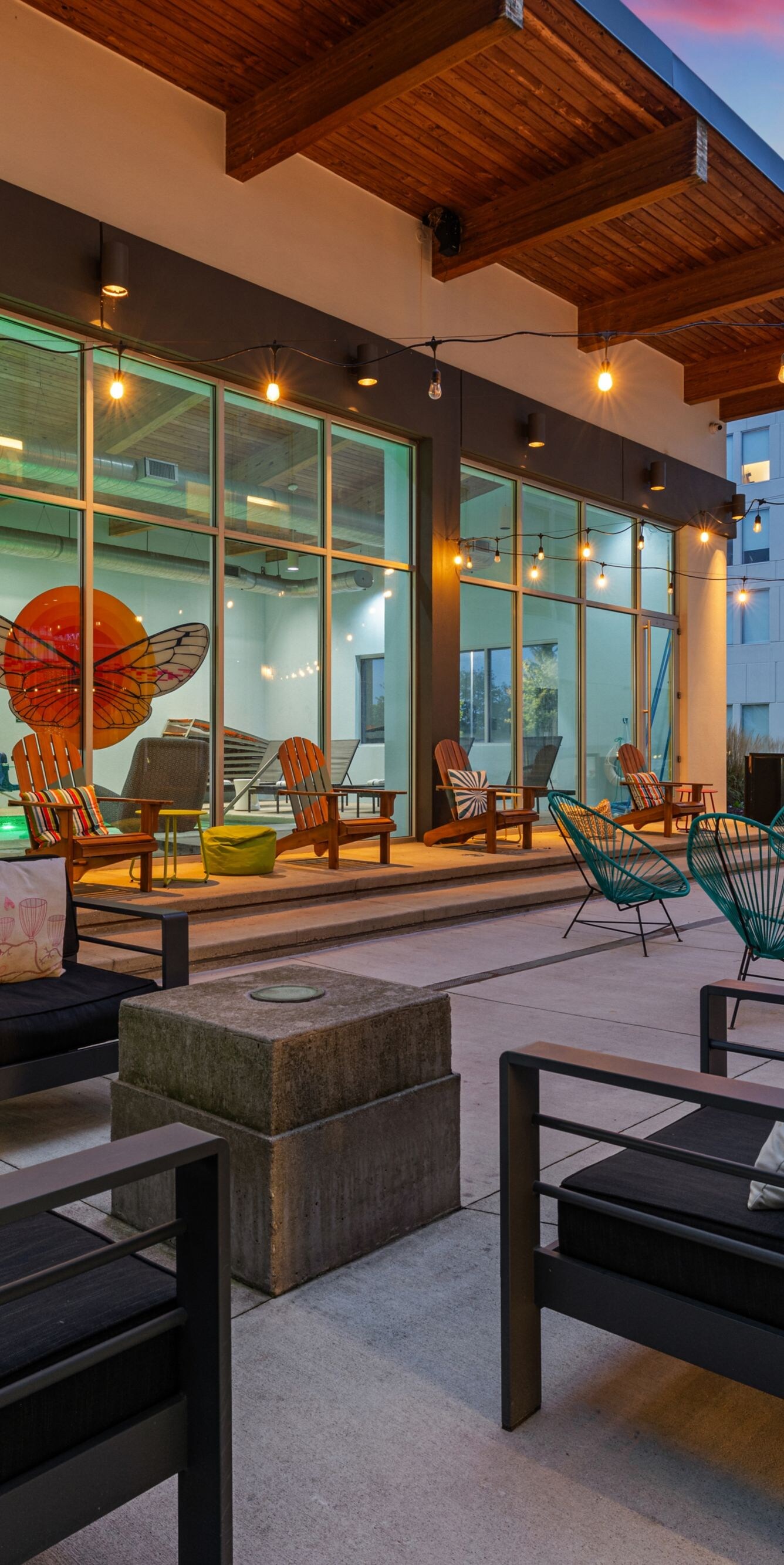 Courtyard seating beneath glowing string lights